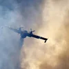 Als Pilot vun engem Läschfliger an der Gironde am Asaz: "Es ist traurig zu sehen" | © EPA/SEBASTIEN NOGIER